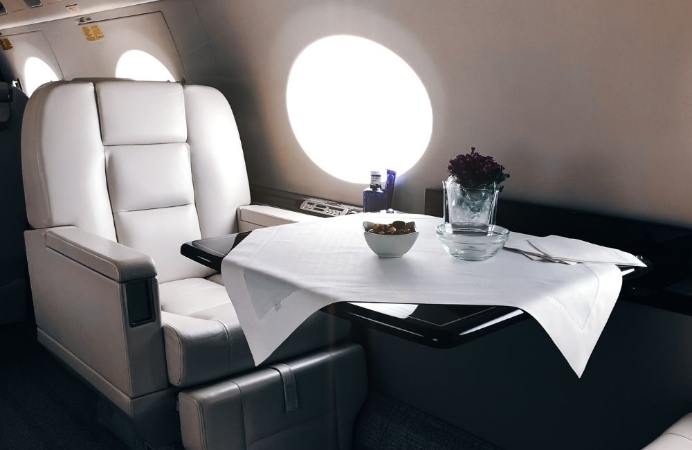 Discreet VIP Protection for Executive and International Travel Interior of a private executive aircraft cabin, representing discreet VIP protection and secure travel planning for high-risk environments.