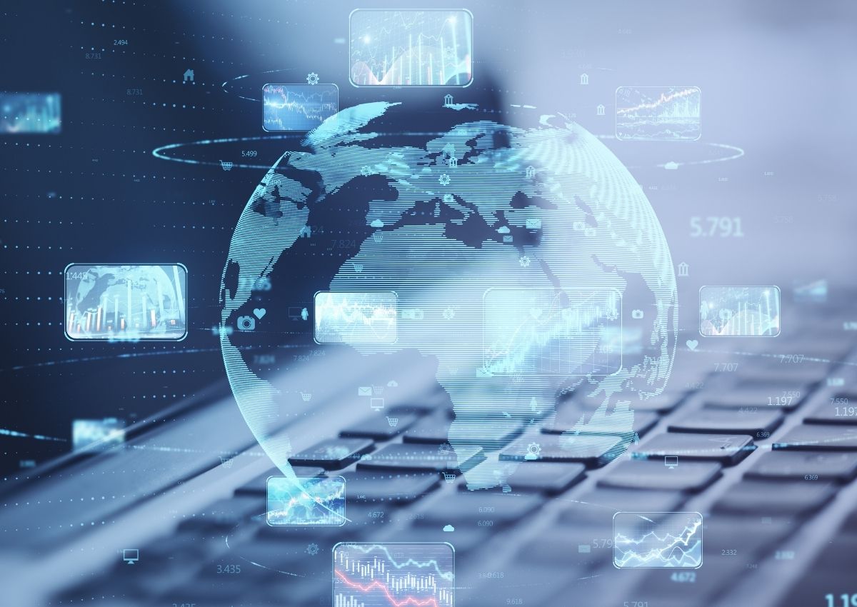 Global Digital Forensics and Cyber Intelligence Abstract digital globe overlaying a laptop keyboard with data visualisations, representing global cyber intelligence, digital forensics and cross-border electronic evidence analysis by Grudko Associates.