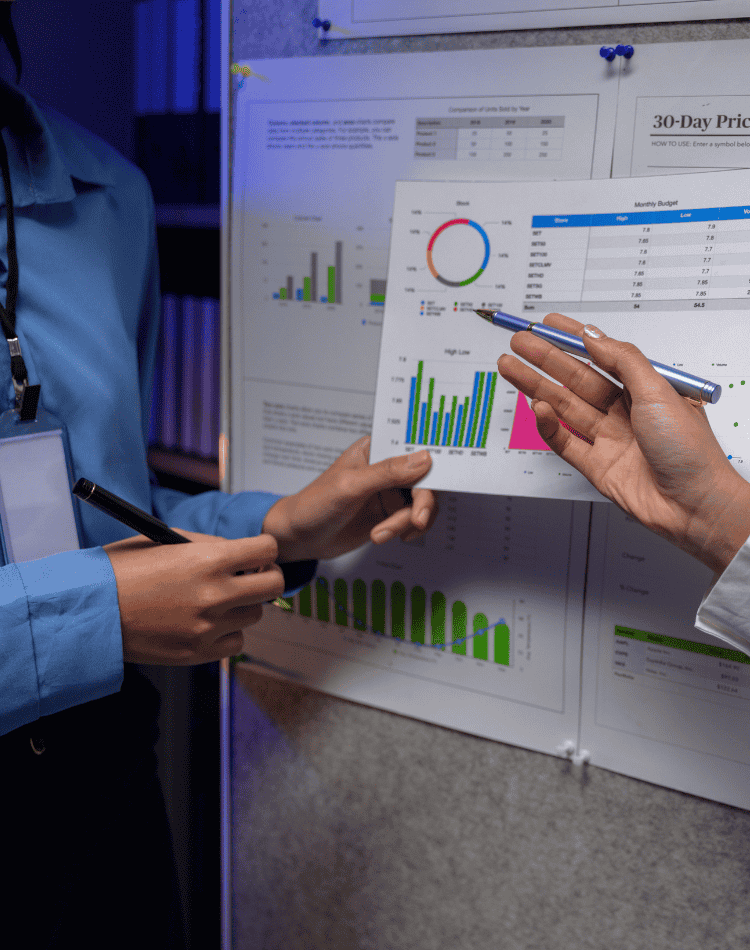 Professionals reviewing digital charts and data visualisations during a forensic analysis discussion, reflecting structured evidence evaluation and investigative reporting by Grudko Associates.