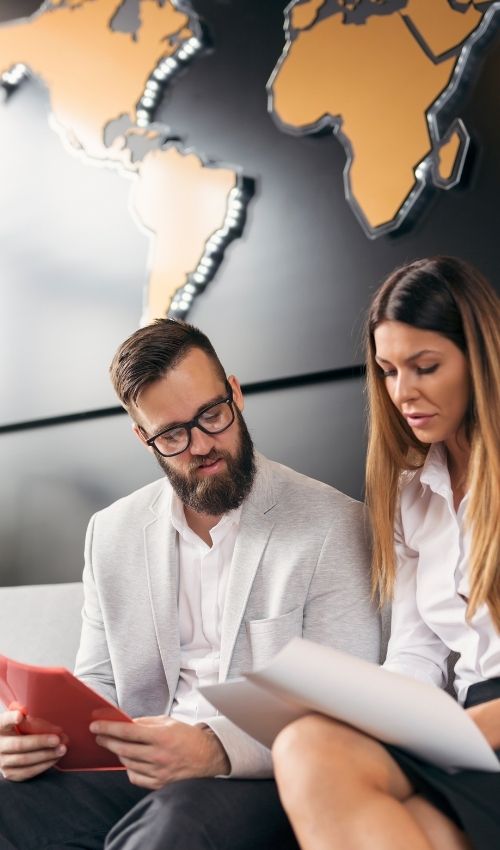 Investigative documents and analytical reports being reviewed in a professional office, illustrating evidence-led decision-making and forensic due diligence within a South African investigative firm.